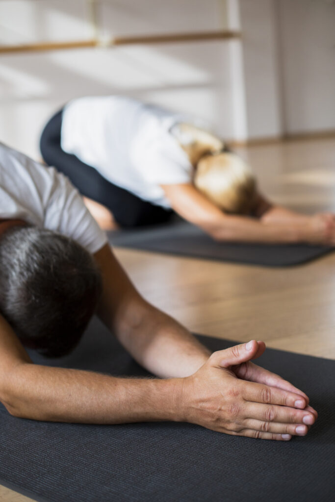 senior-couple-stretching-together